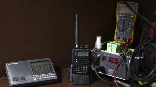 Radio equipments at Sofi's residence. Sandeep Baruah, a scientist and in-charge of the Vigyan Prasar Amateur Radio Club Station in Delhi, states that ham radio is far from dying. According to him, there has been a rise in the number of ham meets and festivals in the past few years. He further says that it’s a hobby that fosters scientific temperament and empowers individuals who indulge in it. (Biplov Bhuyan / HT Photo) Radio equipments at Sofi's residence. Sandeep Baruah, a scientist and in-charge of the Vigyan Prasar Amateur Radio Club Station in Delhi, states that ham radio is far from dying. According to him, there has been a rise in the number of ham meets and festivals in the past few years. He further says that it’s a hobby that fosters scientific temperament and empowers individuals who indulge in it. (Biplov Bhuyan / HT Photo)
