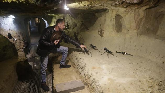 Artist Charles Nassar arranges sculptures of giant ants in his compound in Remhala. Instead, the idea is that “anybody who was bothered by an artillery shell starts to like it,” he added. “I’m trying to turn black into white, something negative into something positive.” (Joseph Eid / AFP) Artist Charles Nassar arranges sculptures of giant ants in his compound in Remhala. Instead, the idea is that “anybody who was bothered by an artillery shell starts to like it,” he added. “I’m trying to turn black into white, something negative into something positive.” (Joseph Eid / AFP)