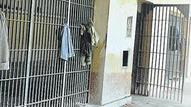 A video clip of an inmate lodged in Tihar jail’s Mandoli campus, which shows the man recording a video on his mobile phone while cooking inside the prison cell has gone viral on social media. (Sonu Mehta/HT File Photo)(HT Photo)