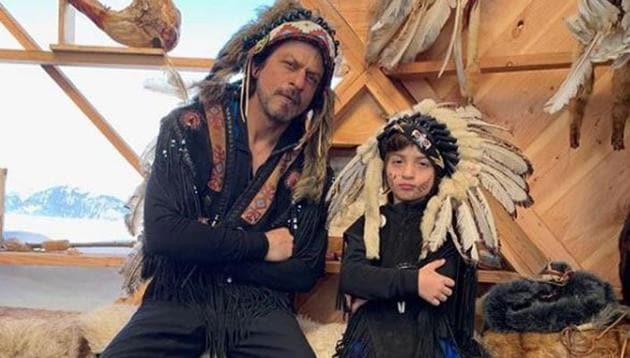 Shah Rukh Khan and AbRam can be seen sporting Native American headgears in a picture shared by Gauri Khan.