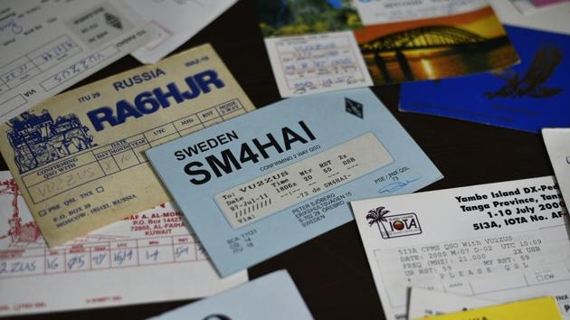 QSL cards at Mohammad Sofi’s residence in New Delhi. Like other passionate hams, Sofi has hundreds of QSL cards received from stations all over the world with call sign, date, time, location and signal quality. Some have photographs of the senders and their neighbourhoods. “These are among my most prized possessions; the memories, and proofs of the contacts I made with fellow hams around the world,” he said. (Biplov Bhuyan / HT Photo) QSL cards at Mohammad Sofi’s residence in New Delhi. Like other passionate hams, Sofi has hundreds of QSL cards received from stations all over the world with call sign, date, time, location and signal quality. Some have photographs of the senders and their neighbourhoods. “These are among my most prized possessions; the memories, and proofs of the contacts I made with fellow hams around the world,” he said. (Biplov Bhuyan / HT Photo)