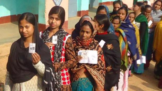 Dumka , Jharkhand, INDIA – December 20: Voters queue waiting to cast their votes on 5th phase election of Jharkhand assembly poll for Santhal Praganna at a polling booth in Dumka on Saturday December 20, 2014.(Hindustan Times)