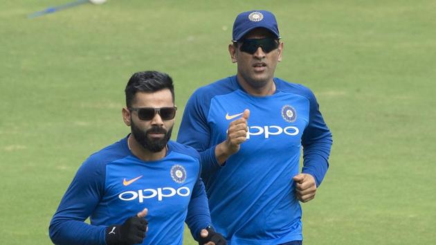 Indian captain Virat Kohli, left, with M S Dhoni, right warm up during a practice session ahead of the first one day international cricket match against Australia, in Hyderabad, India, Friday, March 1, 2019(AP)