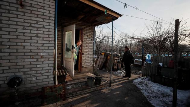 Raisa Taranenko, 73, speaks with her neighbour Nikolai Yushkov near her house, which is around 600 meters from the separatist trenches in Mayorsk. The single-storey building he shares with another family has survived shelling that destroyed surrounding buildings. “Everyone says: you need to sit down and you need to negotiate,” he said. “Peace. We need peace.” (Gleb Garanich / REUTERS) Raisa Taranenko, 73, speaks with her neighbour Nikolai Yushkov near her house, which is around 600 meters from the separatist trenches in Mayorsk. The single-storey building he shares with another family has survived shelling that destroyed surrounding buildings. “Everyone says: you need to sit down and you need to negotiate,” he said. “Peace. We need peace.” (Gleb Garanich / REUTERS)