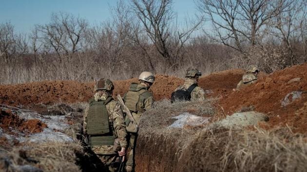 Members of Ukraine's interior ministry's Azov battalion are seen at a front line near the village of Travneve. Destruction and damage are widespread after five years of conflict over eastern Ukraine between government forces and Russian-backed separatists. Around 13,000 people have been killed, a quarter of them civilians, according to the United Nations Human Rights Monitoring Mission in Ukraine. (Gleb Garanich / REUTERS) Members of Ukraine's interior ministry's Azov battalion are seen at a front line near the village of Travneve. Destruction and damage are widespread after five years of conflict over eastern Ukraine between government forces and Russian-backed separatists. Around 13,000 people have been killed, a quarter of them civilians, according to the United Nations Human Rights Monitoring Mission in Ukraine. (Gleb Garanich / REUTERS)