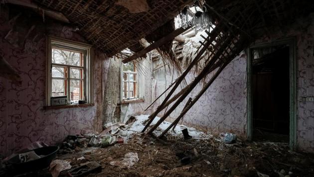 A house damaged by shelling in Zaitseve. Ukraine and NATO accuse Russia of propping up the separatists. Reuters has also documented the involvement of Russian troops and tanks. Moscow says it only provides political and humanitarian support to rebels and Russians fighting in Ukraine are volunteers. The Minsk ceasefire agreement in 2015 staunched the worst of the bloodshed but troops continue to die regularly. (Gleb Garanich / REUTERS) A house damaged by shelling in Zaitseve. Ukraine and NATO accuse Russia of propping up the separatists. Reuters has also documented the involvement of Russian troops and tanks. Moscow says it only provides political and humanitarian support to rebels and Russians fighting in Ukraine are volunteers. The Minsk ceasefire agreement in 2015 staunched the worst of the bloodshed but troops continue to die regularly. (Gleb Garanich / REUTERS)