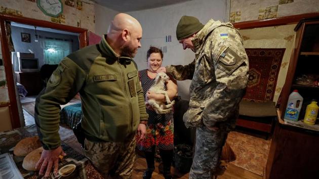 Ukrainian servicemen play with a small goat as they deliver bread to a resident in Zaitseve. Some 600km away in Kiev, President Petro Poroshenko has made standing up to Russia a central thrust of his political battle for re-election. Those planning to take part in the March 31 presidential vote say the conflict is the single biggest issue facing the country but struggle to identify who can best end it. (Gleb Garanich / REUTERS) Ukrainian servicemen play with a small goat as they deliver bread to a resident in Zaitseve. Some 600km away in Kiev, President Petro Poroshenko has made standing up to Russia a central thrust of his political battle for re-election. Those planning to take part in the March 31 presidential vote say the conflict is the single biggest issue facing the country but struggle to identify who can best end it. (Gleb Garanich / REUTERS)