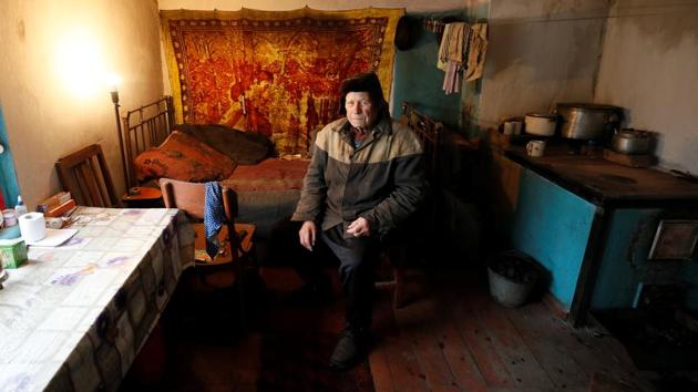 Vitaliy Kudla, 86, in a kitchen in his house, in the village of Zaitseve, Ukraine. There are not many people left in Zaitseve, a village on the front line that divides Ukraine, but voters like Galina Soboleva (not pictured) want just one thing from this month’s presidential election. “Whoever promises us peace, to rebuild our homes, we will vote for them. That’s all we need,” the pensioner said. (Gleb Garanich / REUTERS) Vitaliy Kudla, 86, in a kitchen in his house, in the village of Zaitseve, Ukraine. There are not many people left in Zaitseve, a village on the front line that divides Ukraine, but voters like Galina Soboleva (not pictured) want just one thing from this month’s presidential election. “Whoever promises us peace, to rebuild our homes, we will vote for them. That’s all we need,” the pensioner said. (Gleb Garanich / REUTERS)