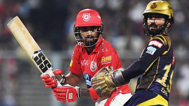 File image: Kings XI Punjab cricketer KL Rahul plays a shot as Kolkata Knight Riders captain Dinesh Karthik looks on.(AFP)