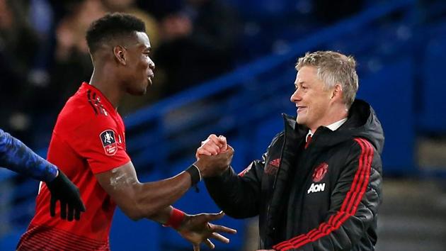 Manchester United's Norwegian caretaker manager Ole Gunnar Solskjaer (R) celebrates their victory with Manchester United's French midfielder Paul Pogba (L) on the pitch (AFP) Manchester United's Norwegian caretaker manager Ole Gunnar Solskjaer (R) celebrates their victory with Manchester United's French midfielder Paul Pogba (L) on the pitch (AFP)