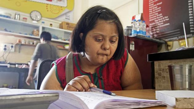 Taking on the responsibilities of running a business, the cafe’s growth has resulted in an experience of realising her aspirations and added to Aditi’s skills as an independent adult. She’s seen here managing the accounts for the cafe, for which she is also the staff and delivery manager. (Hemanshi Kamani / HT Photo) Taking on the responsibilities of running a business, the cafe’s growth has resulted in an experience of realising her aspirations and added to Aditi’s skills as an independent adult. She’s seen here managing the accounts for the cafe, for which she is also the staff and delivery manager. (Hemanshi Kamani / HT Photo)