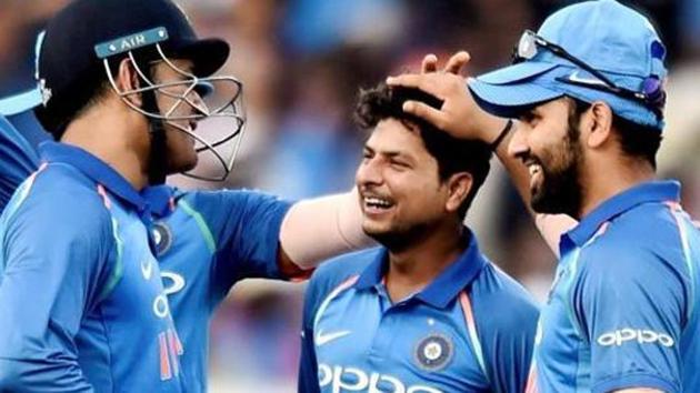 File image of India cricketer Kuldeep Yadav celebrating a fall of wicket with teammates.(PTI)