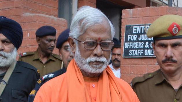 Swami Aseemanand seen outside NIA Court, in Panchkula on March 18.(HT File Photo)