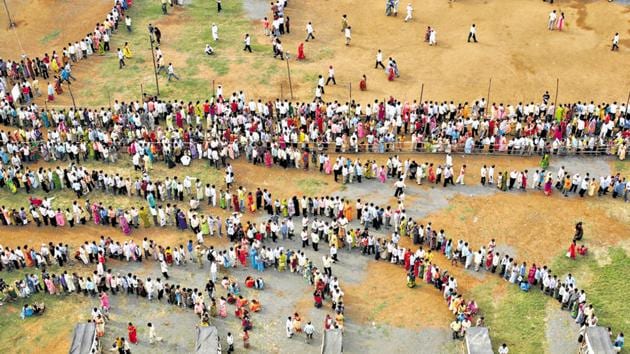 Mumbai, India - October 13, 2009: People queue to cast their votes outside a polling center during the Maharashtra state elections in Chandivali, Mumbai, on October 13, 2009.(Manoj Patil / HT Archive)