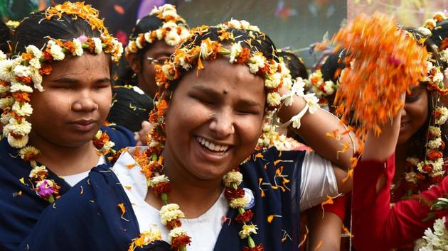 Visually impaired students of LightHouse for the Blind celebrate with flowers on the eve of Holi in Kolkata. (Arijit Sen / HT Photo) Visually impaired students of LightHouse for the Blind celebrate with flowers on the eve of Holi in Kolkata. (Arijit Sen / HT Photo)