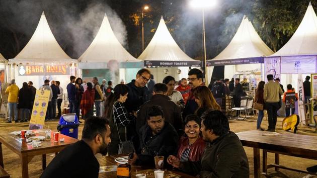 Patrons at an outdoor food court in Nehru Park in New Delhi. Delhi’s affluent, often better informed about the dangers of pollution, increasingly expect the safety measures they have in place at home, to be available when they are out. High-end eateries, bars and cinemas are tapping into that -- installing air purifiers and creating dedicated areas of rich vegetation to help filter airborne toxins. (Chandan Khanna / AFP) Patrons at an outdoor food court in Nehru Park in New Delhi. Delhi’s affluent, often better informed about the dangers of pollution, increasingly expect the safety measures they have in place at home, to be available when they are out. High-end eateries, bars and cinemas are tapping into that -- installing air purifiers and creating dedicated areas of rich vegetation to help filter airborne toxins. (Chandan Khanna / AFP)