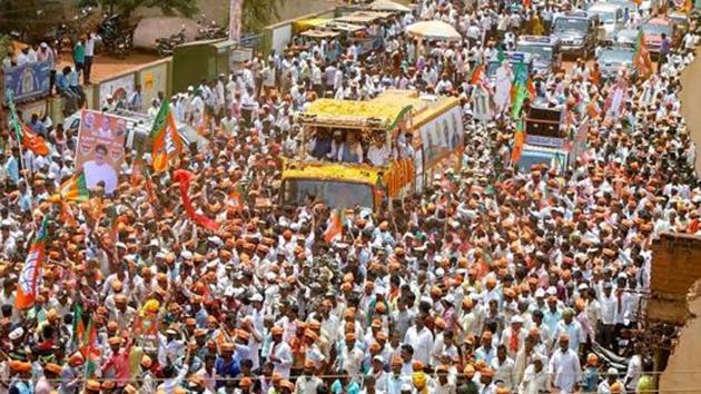 BJP president Amit Shah during a roadshow for an election campaign ahead of Karnataka Assembly elections in Badami.(PTI File Photo)