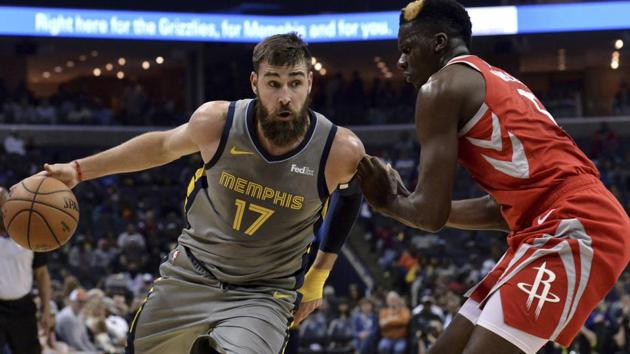 Memphis Grizzlies center Jonas Valanciunas (17) is defended by Houston Rockets center Clint Capela during an NBA match.(AP)