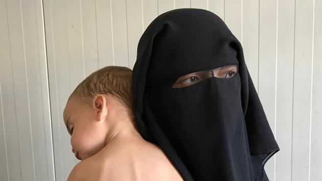Chechen woman Laila Magomedovna Gazieva, the widow of an Islamic State militant, holds her son Obaida at Hammam Al-Alil camp south of Mosul, Iraq. (Azad Lashkari / REUTERS) Chechen woman Laila Magomedovna Gazieva, the widow of an Islamic State militant, holds her son Obaida at Hammam Al-Alil camp south of Mosul, Iraq. (Azad Lashkari / REUTERS)