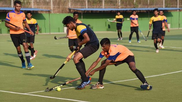 Excellency Academy (orange) win the first edition of the Friendship Cup hockey with a 2-1 victory over Krida Prabodhini at the Major Dhyan-Chand Hockey Stadium, Pimpri ,on Wednesday.(HT PHOTO)