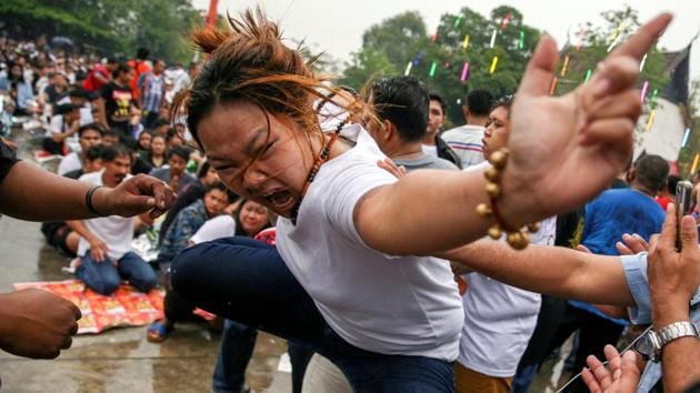 A devotee in trance mimics a beast during a religious tattoo festival at Wat Bang Phra monastery, where devotees believe that their tattoos have mystical powers, in Nakhon Pathom province, Thailand. (Athit Perawongmetha / REUTERS) A devotee in trance mimics a beast during a religious tattoo festival at Wat Bang Phra monastery, where devotees believe that their tattoos have mystical powers, in Nakhon Pathom province, Thailand. (Athit Perawongmetha / REUTERS)
