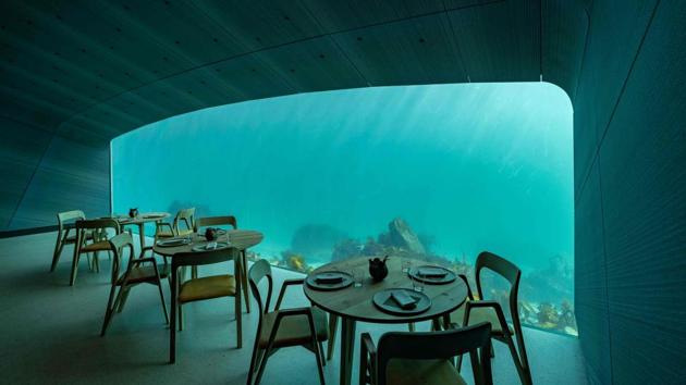 An interior view of a restaurant named Under, that is semi-submerged beneath the waters of the North Atlantic and situated five and a half metres below the surface of the sea in Lindesnes near Kristiansand, Norway. (Tor Erik Schroder / AFP) An interior view of a restaurant named Under, that is semi-submerged beneath the waters of the North Atlantic and situated five and a half metres below the surface of the sea in Lindesnes near Kristiansand, Norway. (Tor Erik Schroder / AFP)