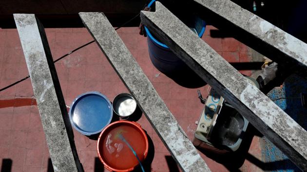 Buckets filled with water stand next to a washing machine on the roof of an apartment block. Earlier this month, Venezuela was plunged deeper into chaos after a near week-long power blackout cut off the already scant water supply to most residents. Since then, Maduro has promised to place enormous water tanks on the roofs of houses and apartment blocks to alleviate the problem. (Carlos Jasso / REUTERS) 
