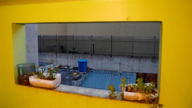 A blue water container is seen from the 4th floor. In Flores’s home, three tanks and several other containers collect water when it comes intermittently. Flores, her husband, and their two little children bathe in one of the tanks, which holds some 18 liters. “It’s hard, too hard, you can die without water,” she said. “We weren’t aware of this before. Water now is gold.” (Carlos Jasso / REUTERS) 