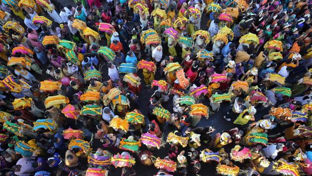 Devotees take part in a procession during the religious festival of Panguni Uthiram celebrated in honour of the Hindu god Muruga in Ahmedabad, Gujarat. (Amit Dave / REUTERS) 