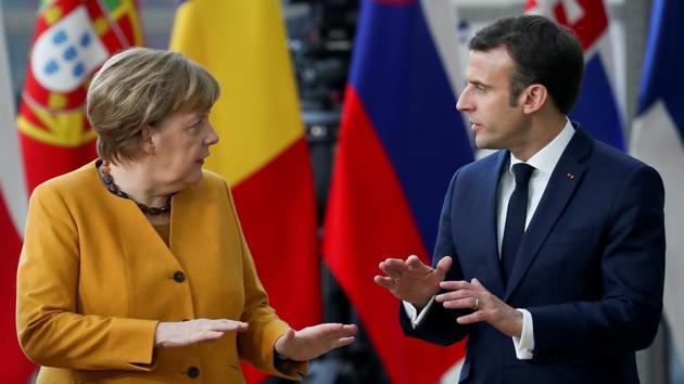 German Chancellor Angela Merkel and French President Emmanuel Macron speak during a European Union leaders summit in Brussels, Belgium. (Yves Herman / REUTERS) German Chancellor Angela Merkel and French President Emmanuel Macron speak during a European Union leaders summit in Brussels, Belgium. (Yves Herman / REUTERS)