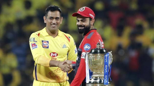 Chennai Super Kings captain Mahendra Singh Dhoni, left, shakes hands with Royal Challengers Bangalore captain Virat Kohli (AP)