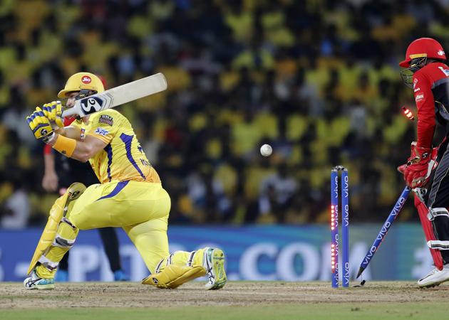 Chennai Super Kings' Shane Watson, left, is bowled out by Royal Challengers Bangalore's Yuzvendra Chahal. (AP)