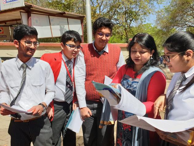 Students of GD Goenka Public School discussing CBSE class 10 English paper after their exams on Saturday (HT)