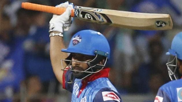 Delhi Capitals Rishabh Pant, left, raises his bat after scoring half-century against Mumbai Indians.(AP)