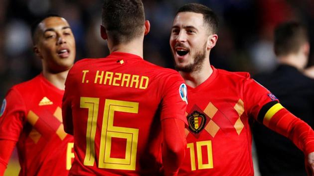 Belgium's Eden Hazard celebrates scoring their first goal with Thorgan Hazard.(REUTERS)