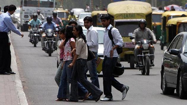 Students walk the most. But too many vehicles, encroachments and poor pedestrian infrastructure often make the walking routes to educational institutions, barring a few university campuses, unsafe.(HT File Photo)