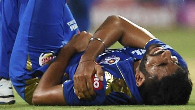 Mumbai Indians Jasprit Bumrah grimaces in pain.(PTI)