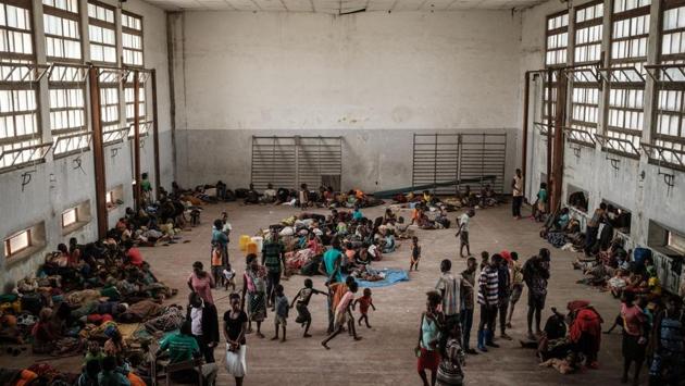 People from the isolated district of Buzi take shelter in the Samora M. Machel secondary school used as an evacuation centre in Beira. As many as 109,000 people are living in shelters across central Mozambique, many of them located in and around Beira. (Yasuyoshi Chiba / AFP) People from the isolated district of Buzi take shelter in the Samora M. Machel secondary school used as an evacuation centre in Beira. As many as 109,000 people are living in shelters across central Mozambique, many of them located in and around Beira. (Yasuyoshi Chiba / AFP)