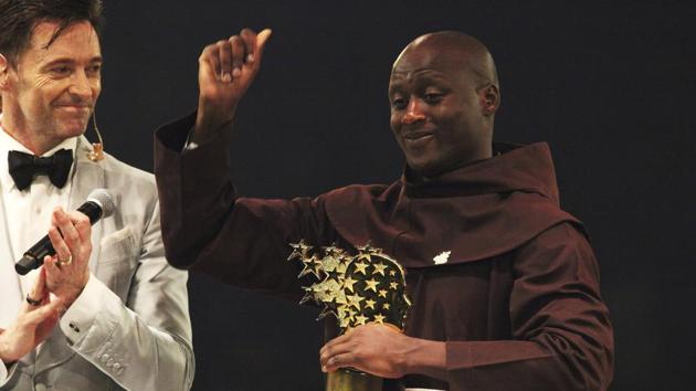 Kenyan teacher Peter Tabichi, right, reacts near actor Hugh Jackman, after winning the $1 million Global Teacher Prize in Dubai. (AP) Kenyan teacher Peter Tabichi, right, reacts near actor Hugh Jackman, after winning the $1 million Global Teacher Prize in Dubai. (AP)