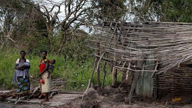 Locals wait to receive food parcels handed out by an aid organisation to locals after Cyclone Idai, near Dondo village outside Beira, Mozambique on March 24.(REUTERS) Locals wait to receive food parcels handed out by an aid organisation to locals after Cyclone Idai, near Dondo village outside Beira, Mozambique on March 24.(REUTERS)