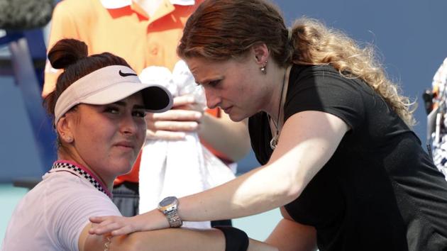 Bianca Andreescu, left, of Canada, receives medical treatment from Lisa Pataky.(AP) Bianca Andreescu, left, of Canada, receives medical treatment from Lisa Pataky.(AP)