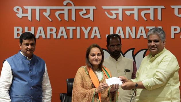 Actress Jaya Prada joined the BJP on Tuesday, fuelling speculations that the party may field her against Samajwadi Party veteran Azam Khan in Rampur, western Uttar Pradesh. Jaya Prada and Azam Khan are arch-rivals and have fought each other bitterly during their stint in the Samajwadi Party. She said she was joining the BJP as she was impressed with the work of Prime Minister Narendra Modi. (Mohd Zakir / HT Photo) 
