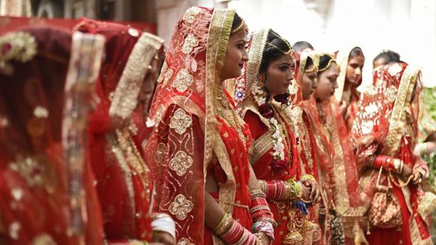 The highly popular mass marriages organised by the Madhya Pradesh government’s social justice department have hit a road block this year; not because of any astrological reasons, but due to the imposition of the model code of conduct ahead of the upcoming Lok Sabha elections. This has left numerous families from the poorer sections in the lurch. (Burhaan Kinu / HT File) The highly popular mass marriages organised by the Madhya Pradesh government’s social justice department have hit a road block this year; not because of any astrological reasons, but due to the imposition of the model code of conduct ahead of the upcoming Lok Sabha elections. This has left numerous families from the poorer sections in the lurch. (Burhaan Kinu / HT File)