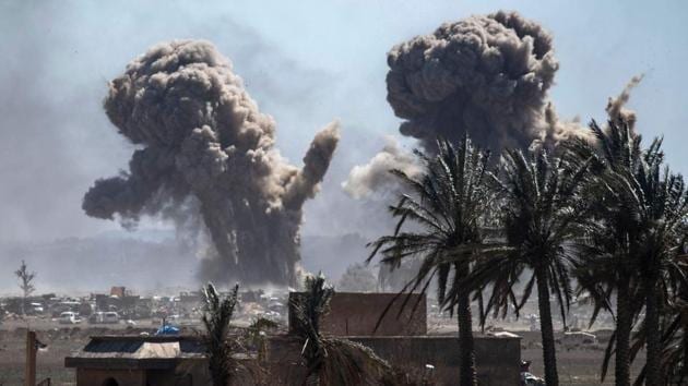 Heavy smoke rises above the Islamic State's last remaining position in the village of Baghouz. SDF fighters, who besieged Baghouz for weeks while planes pounded from above, paraded in memory of 11,000 comrades killed in years of fighting against IS. A band played the American national anthem. Despite the euphoria, Abdi warned the campaign against the militants’ more hidden threats must continue. (Delil Souleiman / AFP) Heavy smoke rises above the Islamic State's last remaining position in the village of Baghouz. SDF fighters, who besieged Baghouz for weeks while planes pounded from above, paraded in memory of 11,000 comrades killed in years of fighting against IS. A band played the American national anthem. Despite the euphoria, Abdi warned the campaign against the militants’ more hidden threats must continue. (Delil Souleiman / AFP)