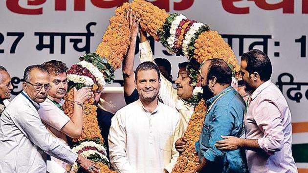 Congress President Rahul Gandhi is garlanded by party members during the All India Congress Committee (AICC) OBC National Convention, at Indira Gandhi Stadium, in New Delhi, India, on Wednesday.(HT Photo)