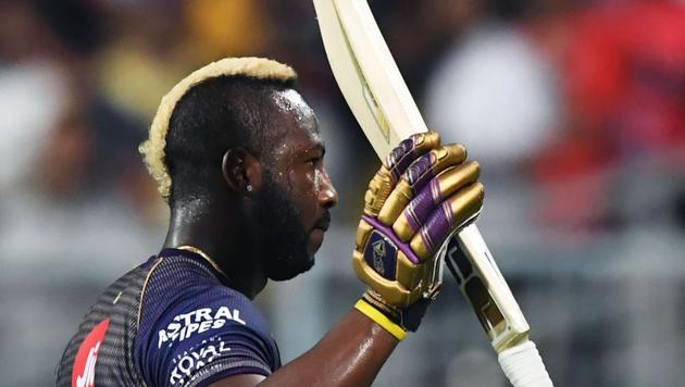 Kolkata Knight Riders cricketer Andre Russell gestures on his way back after losing his wicket.(AFP)