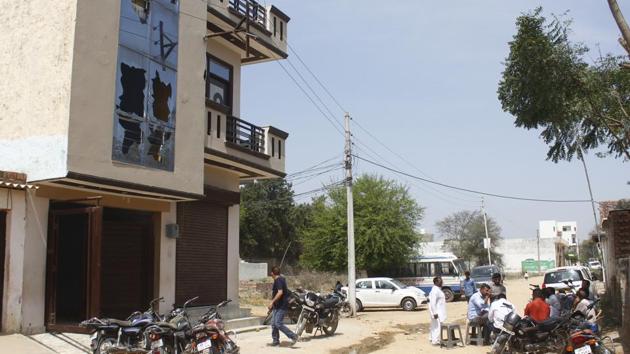 View of the broken window panes at the house of the family that was assaulted by locals on Holi, at Bhoop Nagar village, in Gurugram.(Yogendra Kumar/HT PHOTO)