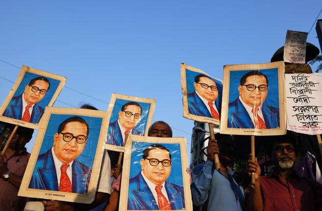 Activists holding portraits of BR Ambedkar during a protest in Kolkata on April 4, 2018.(Dibyangshu Sarkar/AFP) Activists holding portraits of BR Ambedkar during a protest in Kolkata on April 4, 2018.(Dibyangshu Sarkar/AFP)