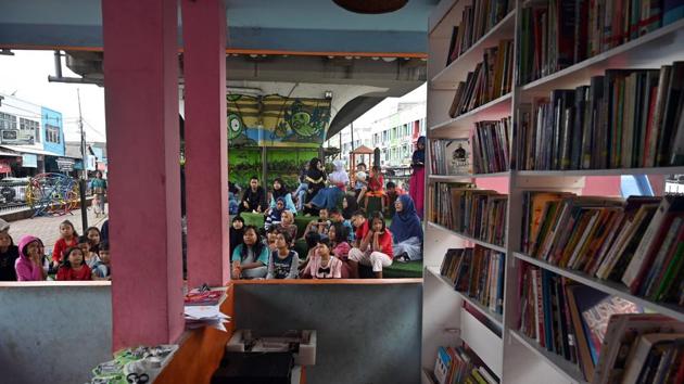 Emilia Clara, an 11-year-old student, said she liked reading stories, especially fairytales, with friends. “It makes me happy and it’s exciting,” she told AFP in a brief interview, before rushing back to join the other kids. And it has won over parents like Salmih Usia, a 41-year-old mother of two. “This is a great place for learning, creating and playing,” she said. (Adek Berry / AFP) Emilia Clara, an 11-year-old student, said she liked reading stories, especially fairytales, with friends. “It makes me happy and it’s exciting,” she told AFP in a brief interview, before rushing back to join the other kids. And it has won over parents like Salmih Usia, a 41-year-old mother of two. “This is a great place for learning, creating and playing,” she said. (Adek Berry / AFP)