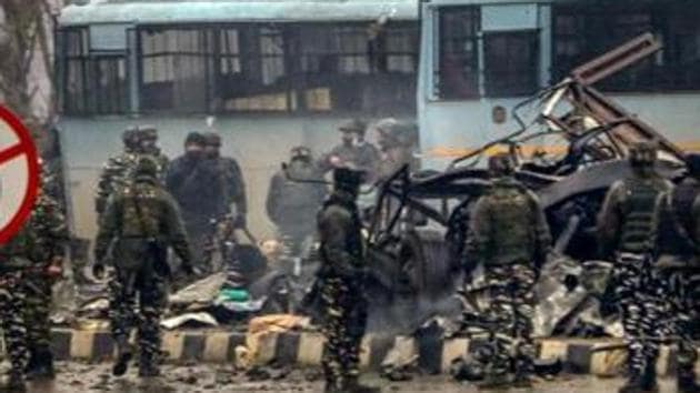 Security personnel carrying out rescue and relief operations at the site of the suicide bombing in Pulwama on February 14.(PTI)